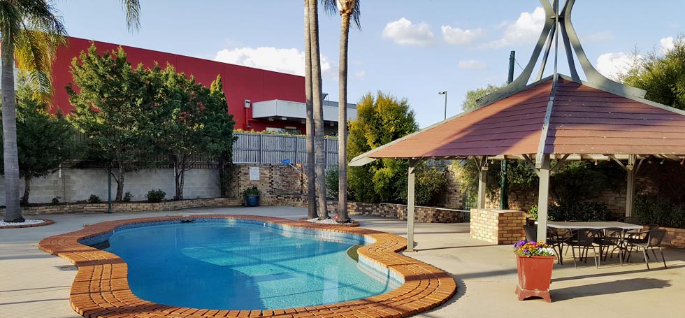 Relax by the pool at Centre Point Mid City Motor Inn. - Warwick QLD